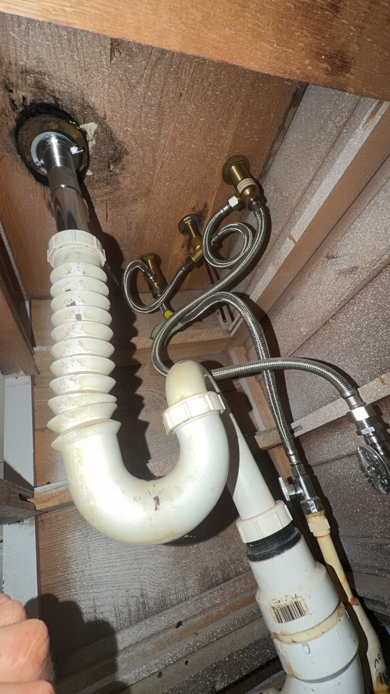 Completed sink drain replacement beneath the sink